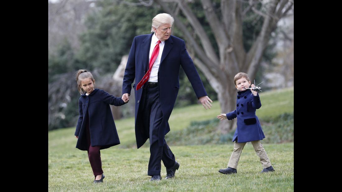 The President and his grandchildren Arabella and Joseph walk across the South Lawn of the White House on Friday, March 3. They were about to board Marine One for a short flight to Andrews Air Force Base.
