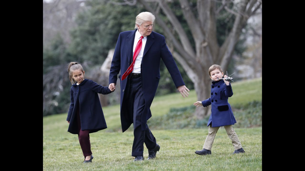 The President and his grandchildren Arabella and Joseph walk across the South Lawn of the White House on Friday, March 3. They were about to board Marine One for a short flight to Andrews Air Force Base.