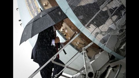 In pouring rain, the President boards Air Force One for a trip to Florida, where he would meet with Chinese President Xi Jinping on Thursday, April 6.