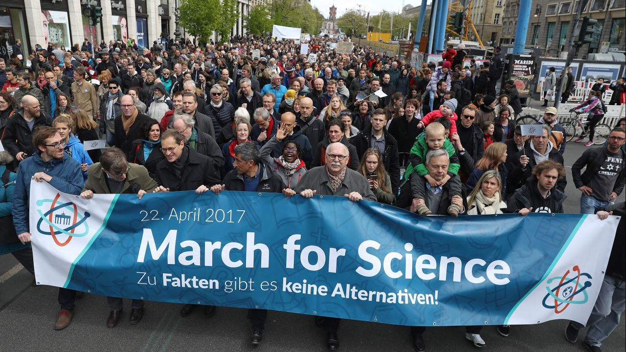 People show support of scientific research in Berlin, Germany, residents march behind a sign that reads, "There are no alternatives to facts." 
