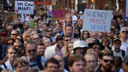 Supporters of science and research gather for the March for Science protest in Sydney on April 22, 2017. 
Thousands of people rallied in Australia and New Zealand on April 22 in support of science, the first of more than 500 marches globally triggered by concern over the rise of "alternative facts". / AFP PHOTO / Peter PARKS        (Photo credit should read PETER PARKS/AFP/Getty Images)