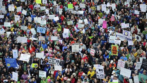 Thousands of protesters fill Tom McCall Waterfront Park during the March for Science in Portland, Oregon, on Saturday, April 22. Protests were held in cities around the world against President Donald Trump's policies. 
