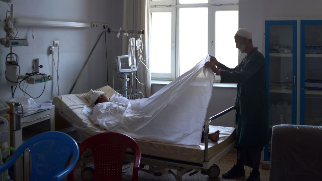A wounded Afghan National Army soldier lies on a hospital bed after last month's Taliban attack.