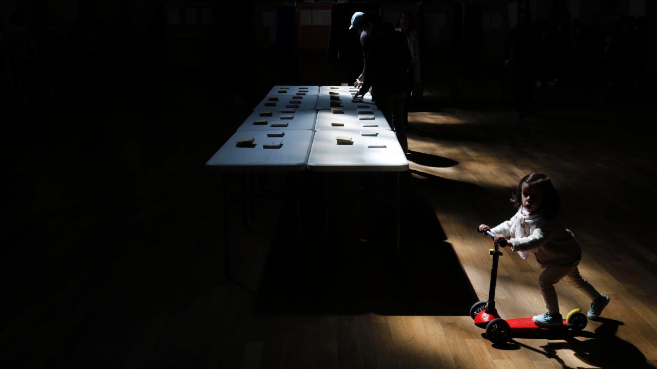 A man picks up ballots in Lyon.