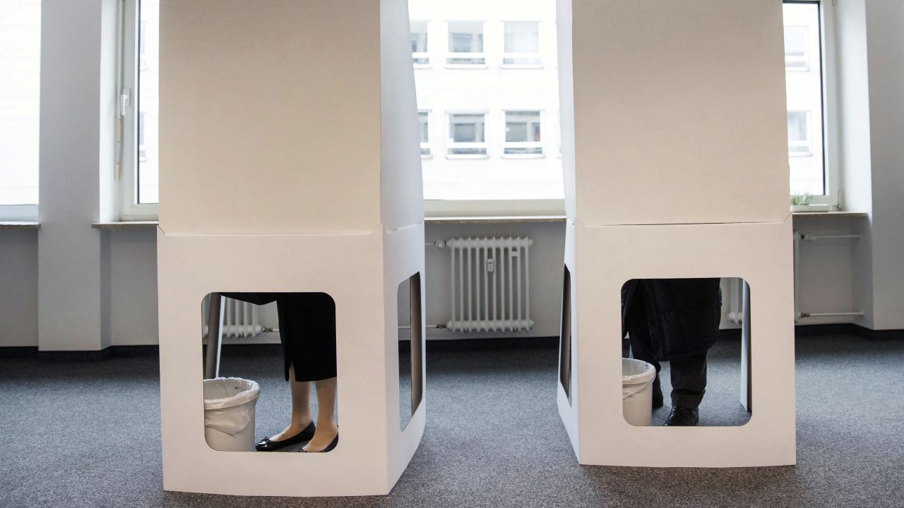 A man and a woman cast their votes at the French consulate in Nuremberg, Germany.