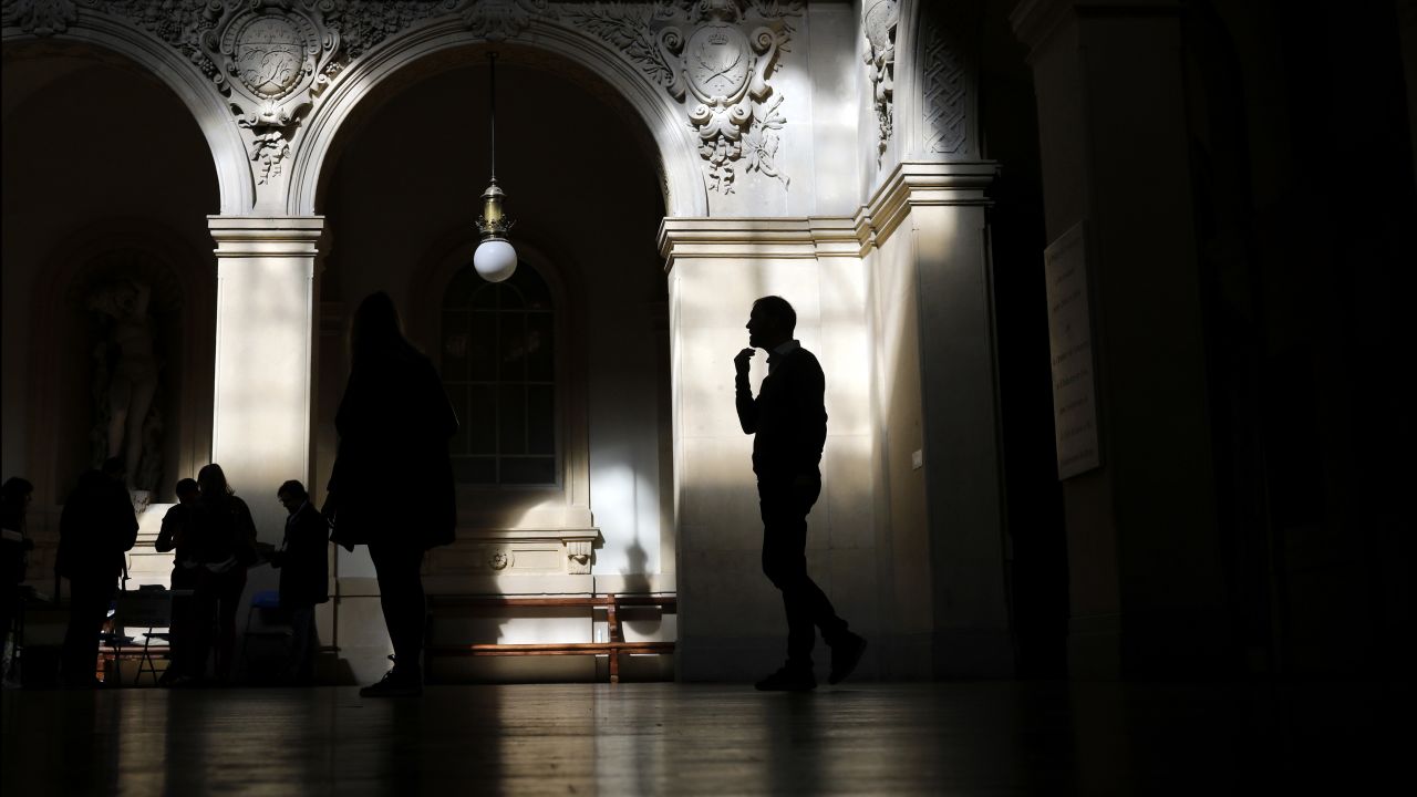 A voter waits to cast his ballot in Lyon.