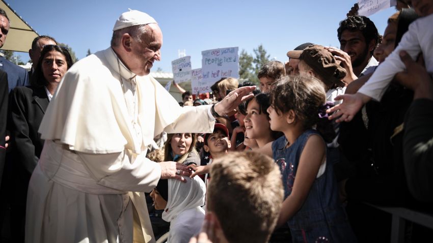 MYTILENE, GREECE - APRIL 16:  In this handout image provided by Greek Prime Minister's Office, Pope Francis meets migrants at the Moria detention centre on April 16, 2016 in Mytilene, Lesbos, Greece. Pope Francis will visit migrants at the Moria camp on the Greek island of Lesbos along with Greek Orthodox Ecumenical Patriarch Bartholomew I and Archbishop of Athens and All Greece, Ieronimos II.  (Photo by Andrea Bonetti/Greek Prime Minister's Office via Getty Images)