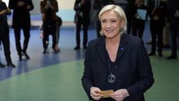 French far-right Front National party's President Marine Le Pen is waiting before she votes in the first round of 2017 French presidential election at a polling station on April 23 in Henin-Beaumont, northern France. 