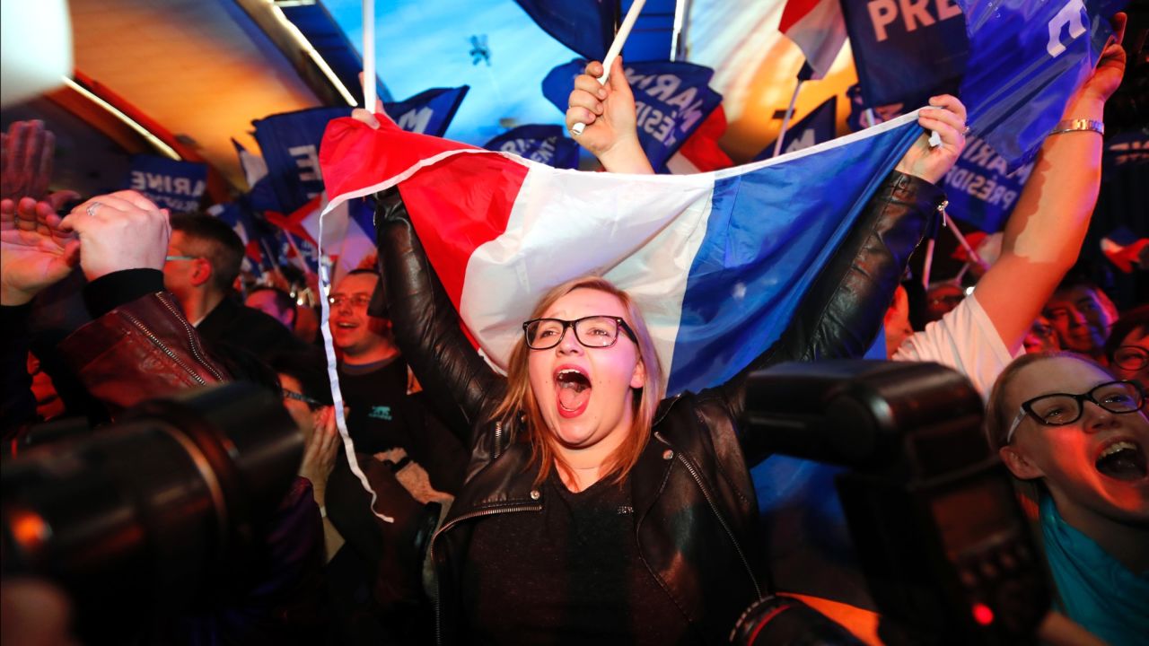 Le Pen supporters celebrate exit-poll results on April 23.