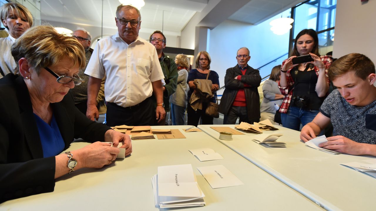 Scrutineers count votes at the end of the first round in Sable-sur-Sarthe. 