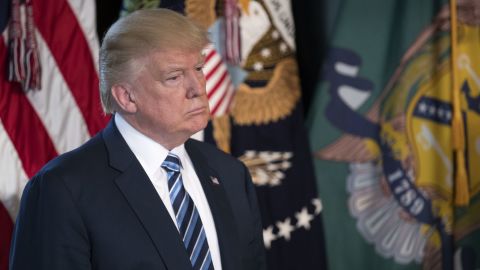 WASHINGTON, DC - APRIL 21: (AFP OUT) U.S. President Donald Trump (L) listens as Secretary of Treasury Steven Mnuchin delivers remarks in the US Treasury Department building on April 21, 2017 in Washington, DC. President Trump is making his first visit to the Treasury Department for a memorandum signing ceremony with Secretary Mnuchin. (Photo by Shawn Thew - Pool/Getty Images)