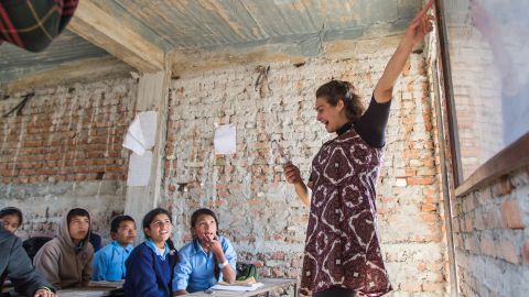Ellen Stewart, a Conscious Impact volunteer, teaches 7th graders about environmental awareness at the Nawalpur Secondary School.