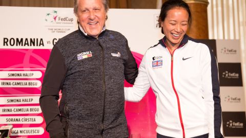Ilie Nastase and Anne Keothavong posing for photos at the start of theFed Cup tie between Great Britain and Romania. 