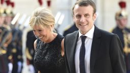 French Economy Minister Emmanuel Macron (R) and his wife Brigitte Trogneux arrive at the Elysee presidential palace in Paris to attend a state dinner as part of the three-day offical visit of the King and Queen of Spain, on June 2, 2015.  AFP PHOTO / ERIC FEFERBERG        (Photo credit should read ERIC FEFERBERG/AFP/Getty Images)