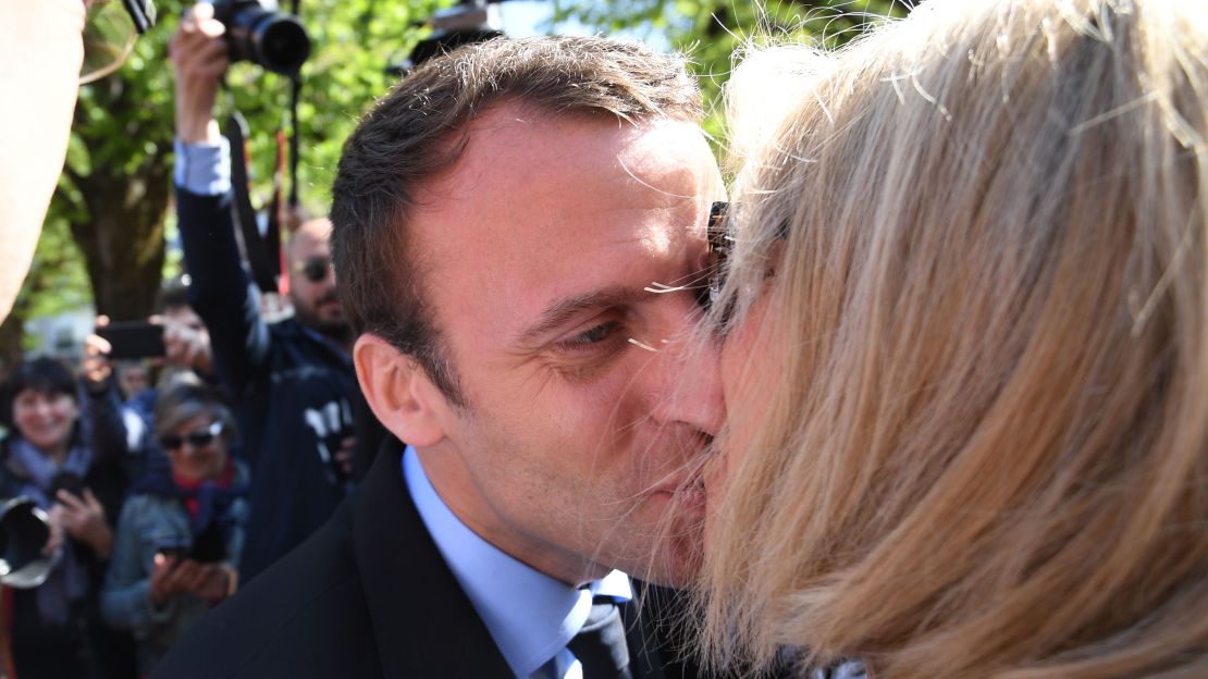 Macron kisses his wife during a campaign visit in Bagneres-de-Bigorre on April 12.