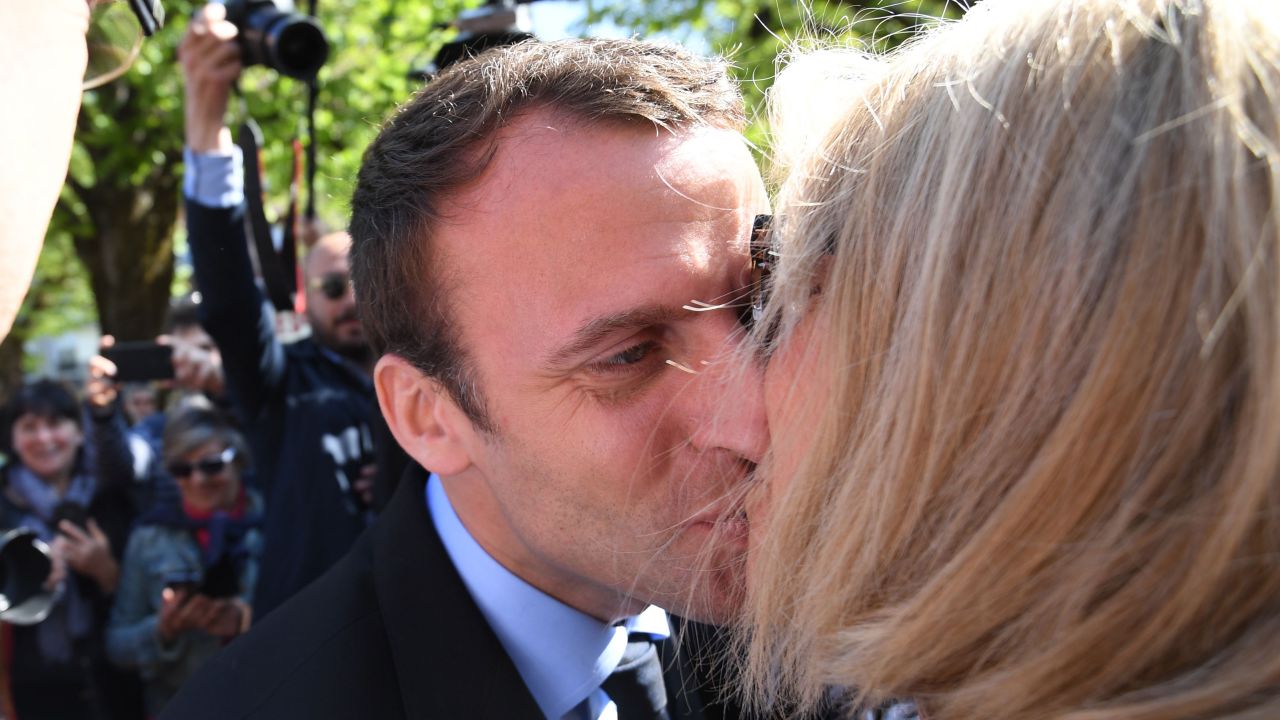 Macron kisses his wife during a campaign visit in Bagneres-de-Bigorre on April 12.