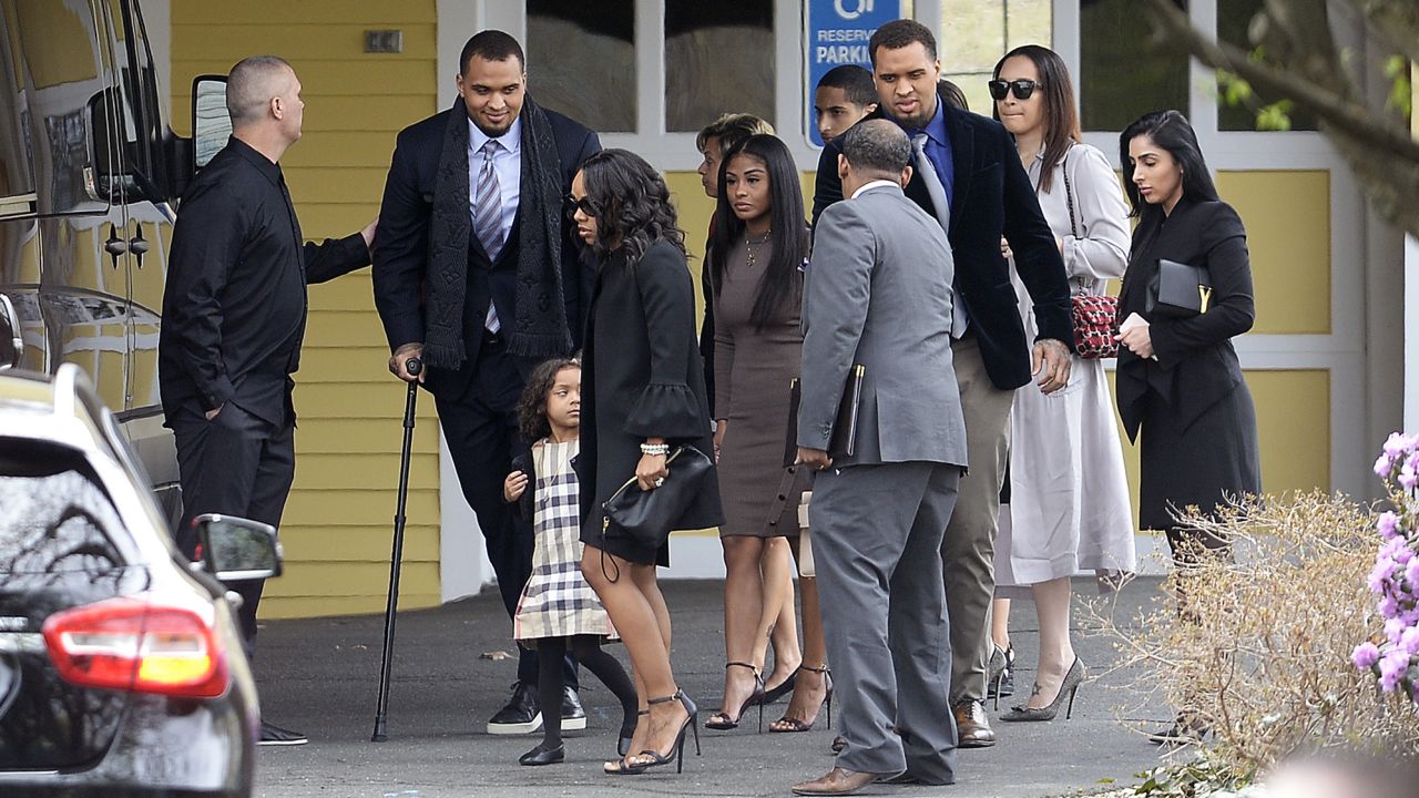 Shayanna Jenkins-Hernandez, fiancee of Aaron Hernandez, arrives with their daughter at funeral