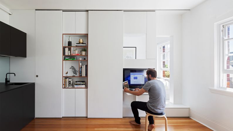 The white cupboards that encircle the bed, which the architects call Tetris pieces, were designed to provide maximum storage in a minimum of space.