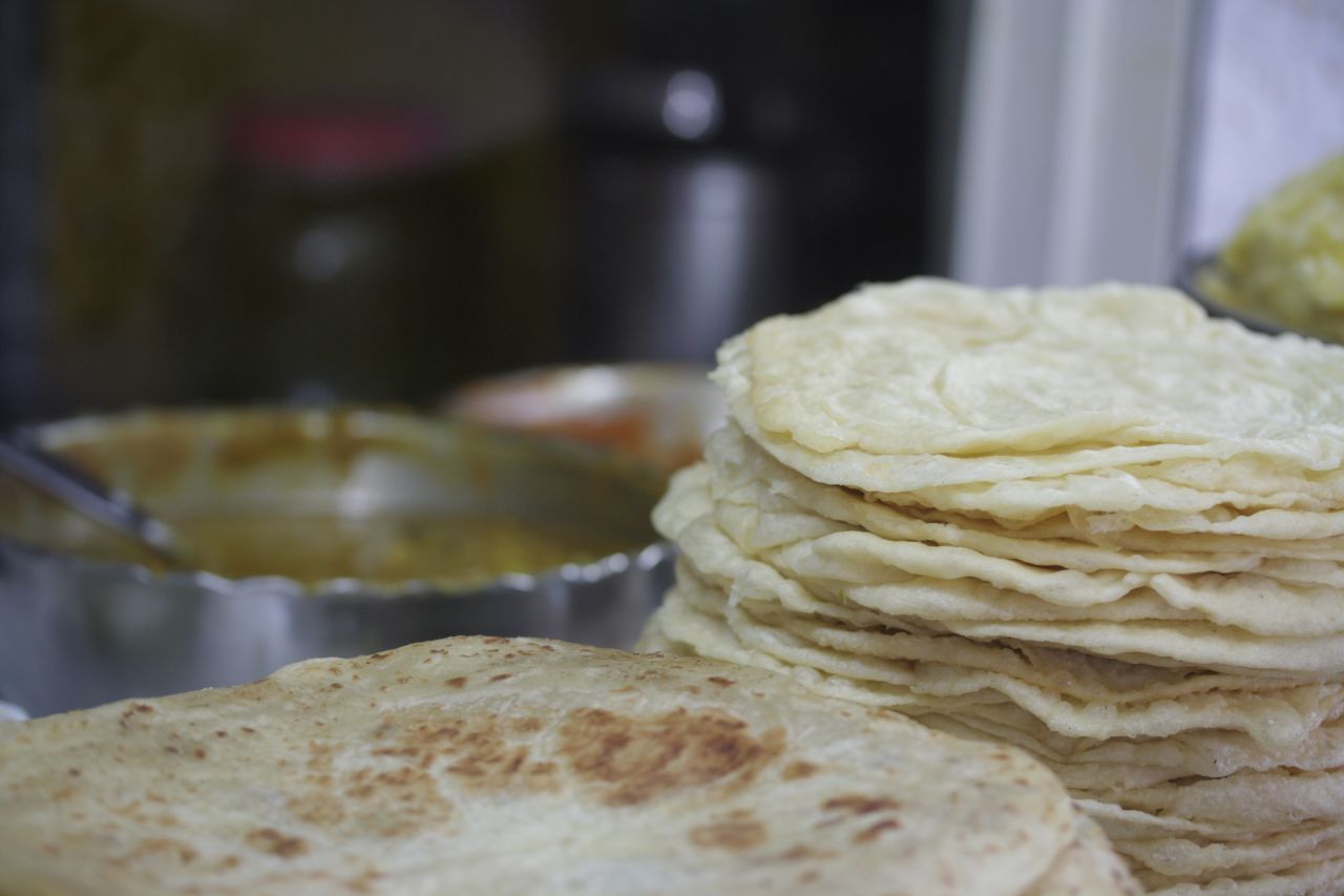 Dahl puri, lentil dhal served in a roti, is a popular street food dishes on the island.