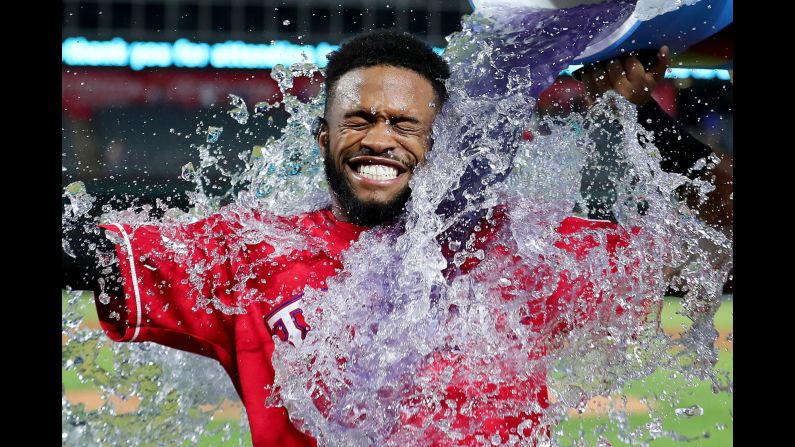 Delino DeShields Jr. is doused by his Texas teammates after hitting the game-winning single against Kansas City on Thursday, April 20. The hit came in the bottom of the 13th inning.