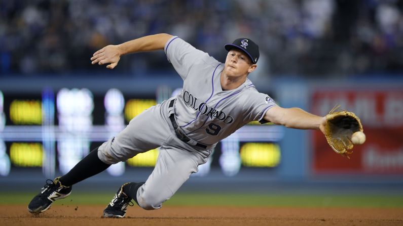 Colorado second baseman DJ LeMahieu tries to snag a grounder during a Major League Baseball game in Los Angeles on Wednesday, April 19.
