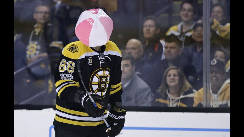 Boston forward David Pastrnak juggles a beach ball that landed on the ice during an NHL playoff game against Ottawa on Wednesday, April 19.