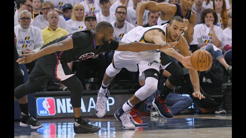 Los Angeles Clippers guard Raymond Felton, left, competes for a loose ball with Utah's Rudy Gobert during an NBA playoff game on Sunday, April 23. 