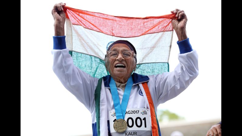 Man Kaur, a 101-year-old woman from India, celebrates after running a 100-meter dash at the World Masters Games on Monday, April 24. She was the only athlete in her age category (100+).