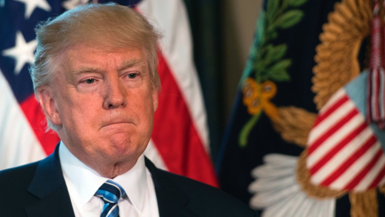 US President Donald Trump looks on before signing finical services executive orders and memorandums at the US Treasury Department in Washington, DC, April 21, 2017. / AFP PHOTO / JIM WATSON        (Photo credit should read JIM WATSON/AFP/Getty Images)