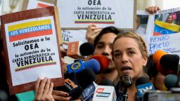 Lilian Tintori (L), wife of jailed Venezuelan opposition leader Leopoldo Lopez submits to the president of the National Assembly, Julio Borges (R) a request for the Organization of American States (OAS) for the activation of the Inter-American Democratic Charter, at the National Assembly in Caracas on March 7, 2017. / AFP PHOTO / FEDERICO PARRA        (Photo credit should read FEDERICO PARRA/AFP/Getty Images)