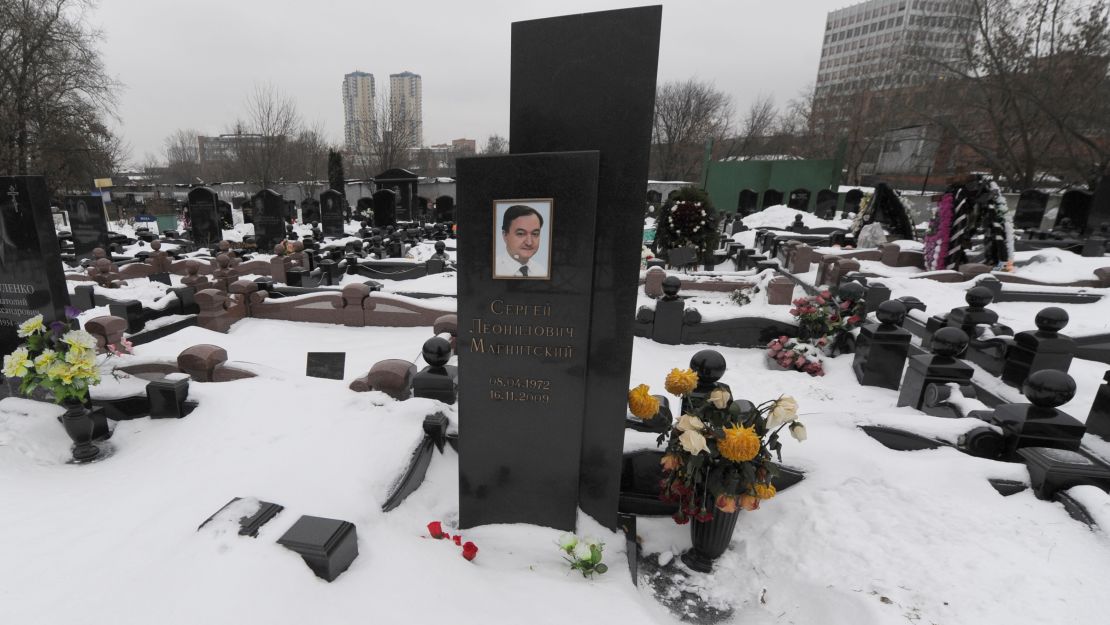 A picture taken on December 7, 2012, shows  snow clad grave of Russian lawyer Sergei Magnitsky with his portrait on the tomb (C) at the Preobrazhenskoye cemetery in Moscow. The US Congress drew today a furious response from the Kremlin by passing legislation that targeted human rights abusers in the prison death of Magnitsky. Moscow immediately called the action "a theater of the absurd" and vowed to retaliate, turning what would have been a boost in trade relations between the two powers into another source of friction.  AFP PHOTO / ANDREY SMIRNOV        (Photo credit should read ANDREY SMIRNOV/AFP/Getty Images)
