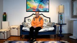 Michael J. Uvanni of Rome, N.Y., sits in one of his two interior design business showrooms in April 2017. Uvanni said his brother may have gotten more time from the many drugs he tried during his illness but that his quality of life was mostly terrible. (Mike Roy/for Kaiser Health News)