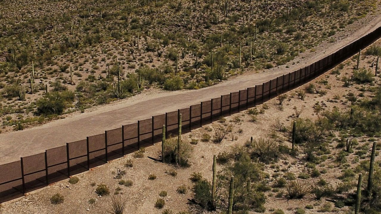 View of the metal fence along the border in Sonoyta, Sonora state, northern Mexico, between the Altar desert in Mexico and the Arizona desert in the United States, on March 27, 2017.
Threatened species like the Sonoran pronghorn or desert bighorn sheep freely cross the border between Mexico and the United States in protected biospheres, but the construction of US President Donald Trump's wall will block their movement in these desert valleys and could drive them to extinction. / AFP PHOTO / PEDRO PARDO        (Photo credit should read PEDRO PARDO/AFP/Getty Images)