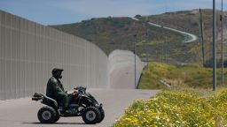 Border Patrol agents patrol the US-Mexico border prior to an Easter mass at the fence separating the two countries at Friendship Park in San Ysidro, California on Sunday, April 16, 2017.    / AFP PHOTO / Sandy Huffaker        (Photo credit should read SANDY HUFFAKER/AFP/Getty Images)