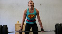 SAN ANSELMO, CA - MARCH 14:  Lita Collins does a deadlift during a CrossFit workout at Ross Valley CrossFit on March 14, 2014 in San Anselmo, California. CrossFit, a high intensity workout regimen that is a constantly varied mix of aerobic exercise, gymnastics and Olympic weight lifting, is one of the fastest growing fitness programs in the world. The grueling cult-like core strength and conditioning program is popular with firefighters, police officers, members of the military and professional athletes. Since its inception in 2000, the number of CrossFit affiliates, or "boxes" has skyrocketed to over 8,500 worldwide with more opening every year.  (Photo by Justin Sullivan/Getty Images)