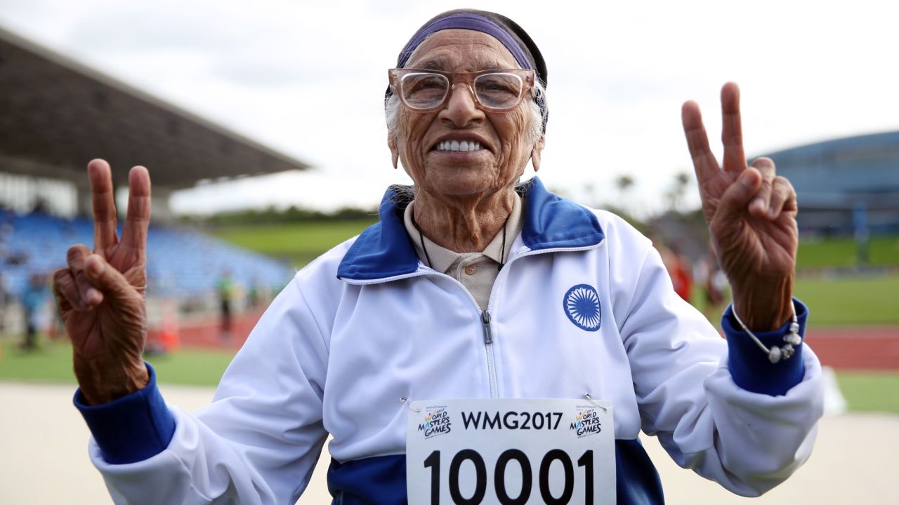 101-year-old Man Kaur from India celebrates after competing in the 100m sprint in the 100+ age category at the World Masters Games at Trusts Arena in Auckland on April 24, 2017. / AFP PHOTO / MICHAEL BRADLEY        (Photo credit should read MICHAEL BRADLEY/AFP/Getty Images)