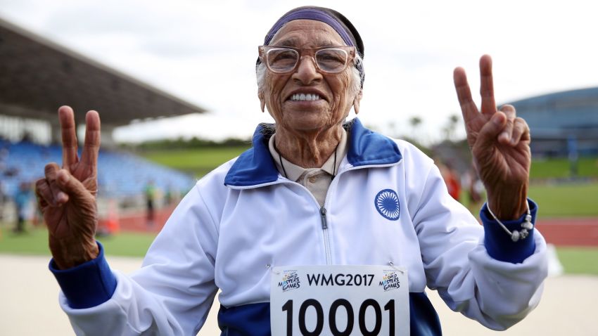 101-year-old Man Kaur from India celebrates after competing in the 100m sprint in the 100+ age category at the World Masters Games at Trusts Arena in Auckland on April 24, 2017. / AFP PHOTO / MICHAEL BRADLEY        (Photo credit should read MICHAEL BRADLEY/AFP/Getty Images)