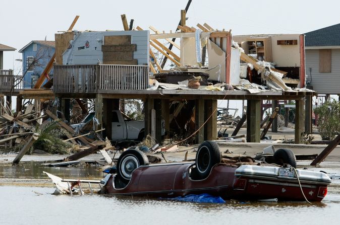 A home and a car lie amid the debris of Hurricane Ike on September 17, 2008, in Crystal Beach, Texas. 