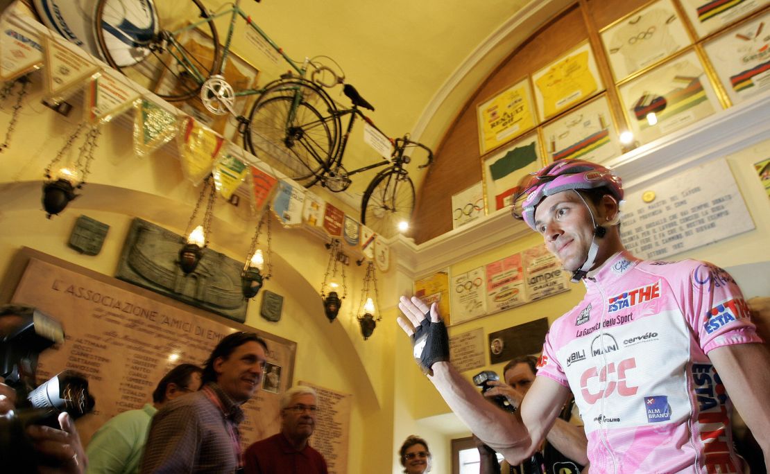 Italy's Ivan Basso, wearing the leader's pink jersey, visits the Ghisallo chapel during the 2006 Giro d'Italia.