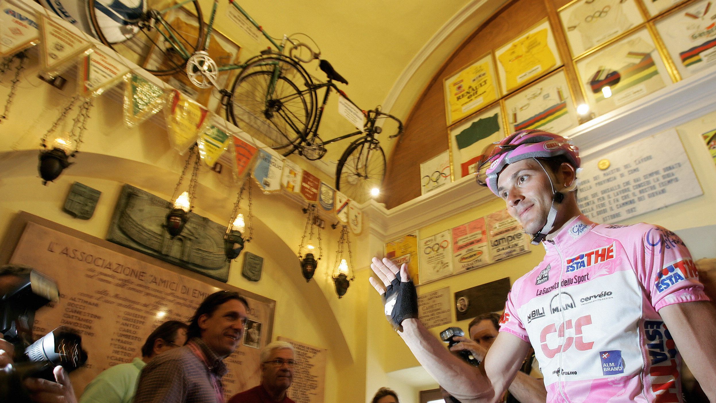 Italy's Ivan Basso, wearing the leader's pink jersey, visits the Ghisallo chapel during the 2006 Giro d'Italia.