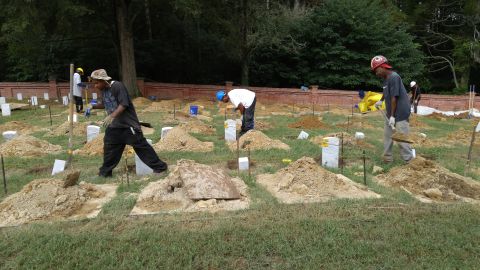 Workers put in new headstones last summer at Poplar Grove National Cemetery.