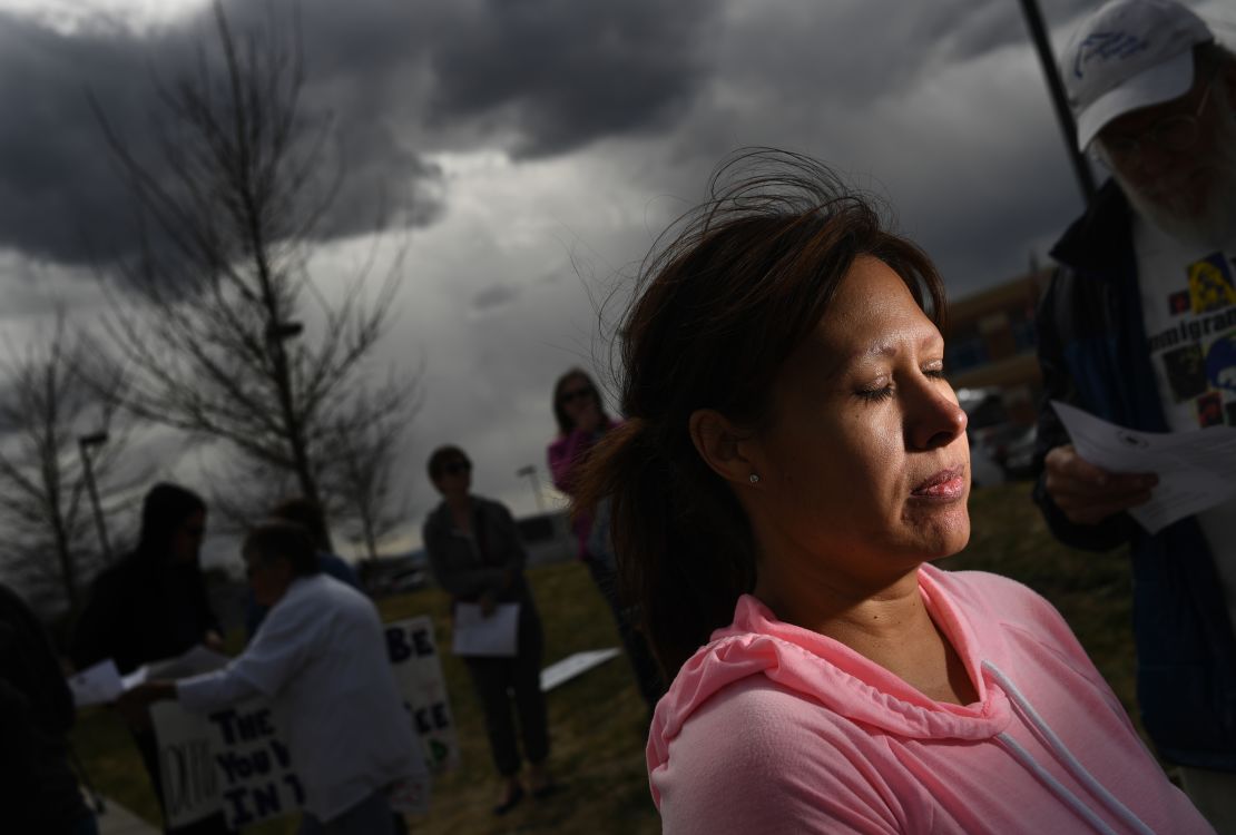 Ana Sauzameda, the wife of Arturo Hernandez, attends a protest Wednesday outside the ICE processing center in Colorado after her husband was detained.
