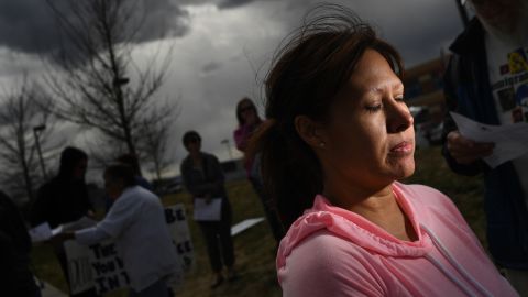 Ana Sauzameda, the wife of Arturo Hernandez, attends a protest Wednesday outside the ICE processing center in Colorado after her husband was detained.