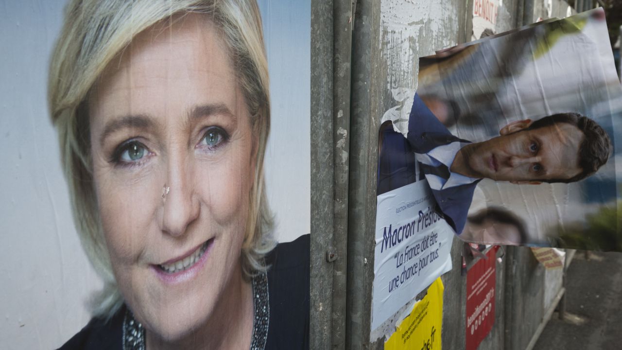 Campaign posters of French presidential election candidates Marine Le Pen and Emmanuel Macron in the Le Pen stronghold of Henin-Beaumont, northern France.