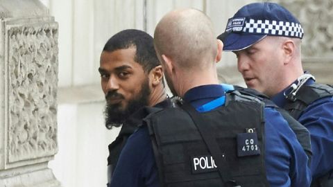 British firearms officers detain a man near the Houses of Parliament in central London on Thursday. 