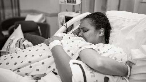 Kim hugs her surrogate Cydnee. " I was beyond grateful for her incredibly selfless act," Kim <a href="http://www.kimjoverton.com/a-miracle-through-surrogacy/" target="_blank" target="_blank">recalls</a> of this moment, "and relieved that the long haul was finally over."