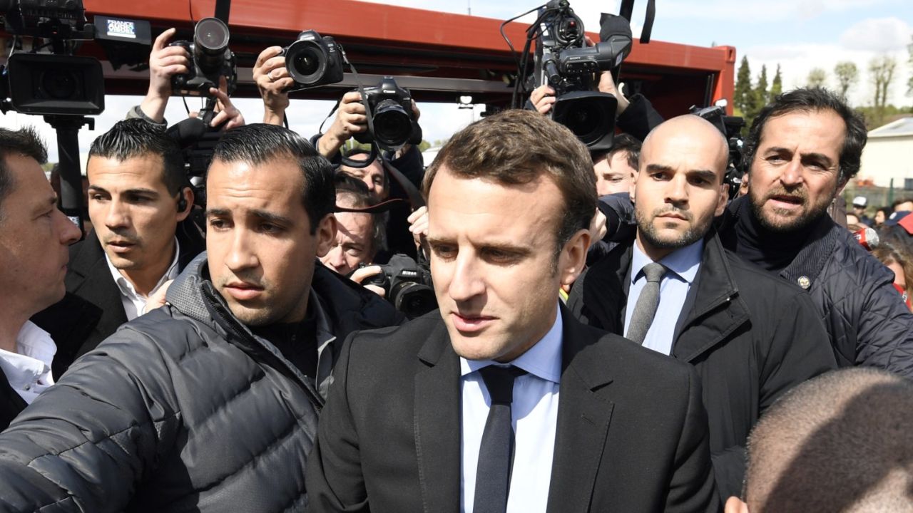 TOPSHOT - French presidential election candidate for the En Marche ! movement Emmanuel Macron arrives outside Whirlpool factory outside the Amiens Cathedral on April 26, 2017.
Macron announced that he would meet with employees of the under-threat Whirlpool factory in Amiens after French far-right presidential candidate Marine Le Pen upstaged him by making a surprise visit to the factory as he was meeting workers' representatives without actually visiting the site. / AFP PHOTO / POOL / Eric FEFERBERG (Photo credit should read ERIC FEFERBERG/AFP/Getty Images)