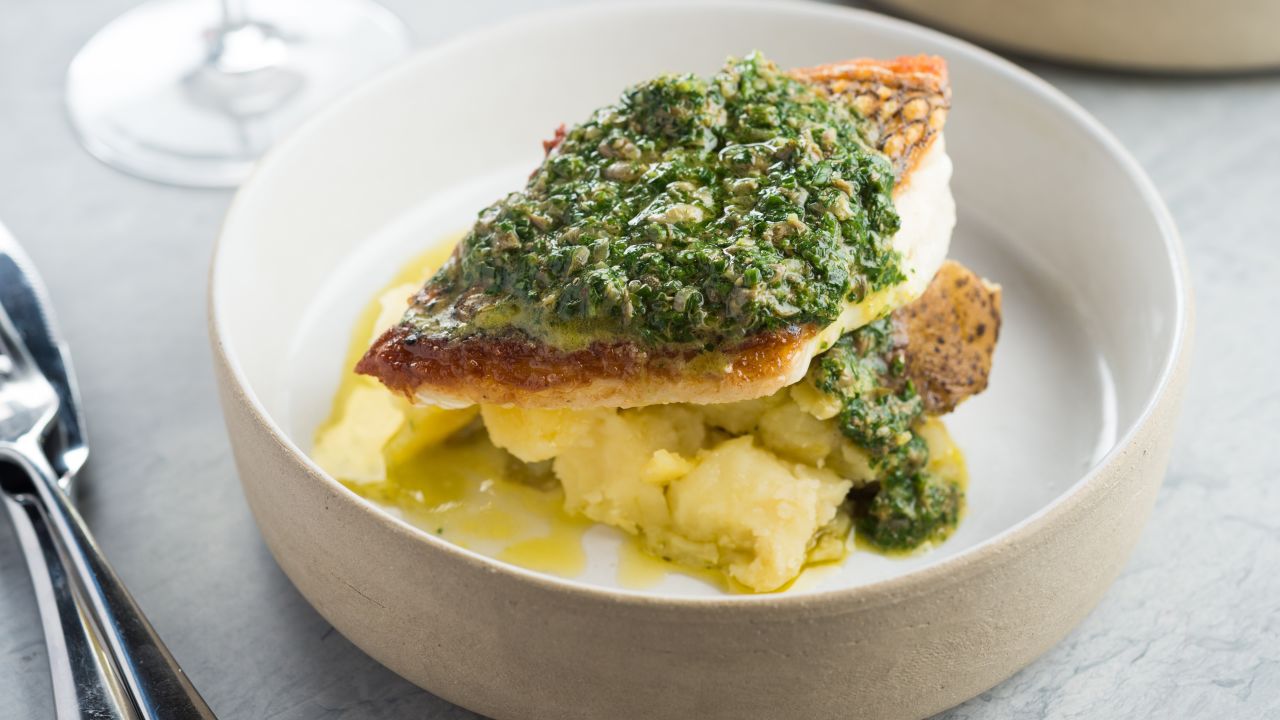 Lilia's black bass with salsa verde and coal-roasted potatoes.