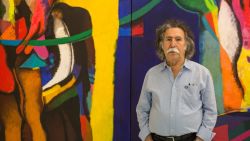Iraqi artist Dia Al-Azzawi poses for a picture with his work at the Arab Museum of Modern Art in the Qatari capital Doha, on October 19, 2016.

Azzawi, who is currently exhibiting his work in Doha, is pessimistic about the future of his country and sees "scenario of destruction " in the battle of Mosul. On October 17, 2016 Iraqi forces launched an operation to retake Mosul from the Islamic State (IS) group jihadists.  / AFP / OLYA MORVAN / RESTRICTED TO EDITORIAL USE - MANDATORY MENTION OF THE ARTIST UPON PUBLICATION - TO ILLUSTRATE THE EVENT AS SPECIFIED IN THE CAPTION        (Photo credit should read OLYA MORVAN/AFP/Getty Images)