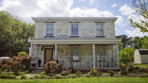 The "Tombstone House" a few miles from the cemetery was coated with the lower part of headstones.
